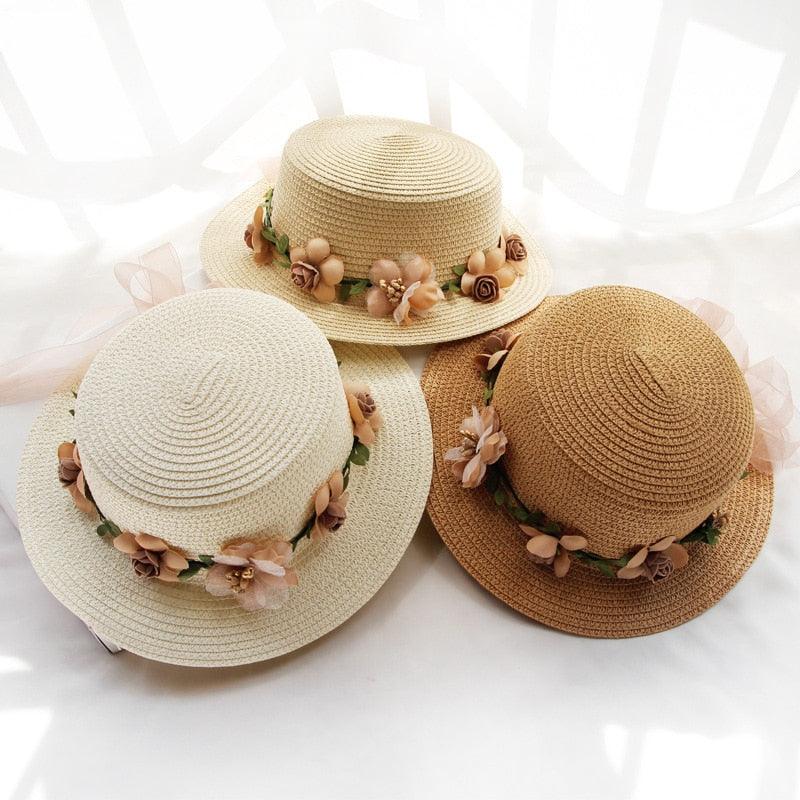 Stylish beige straw bucket hat for women with a decorative floral ribbon bowknot