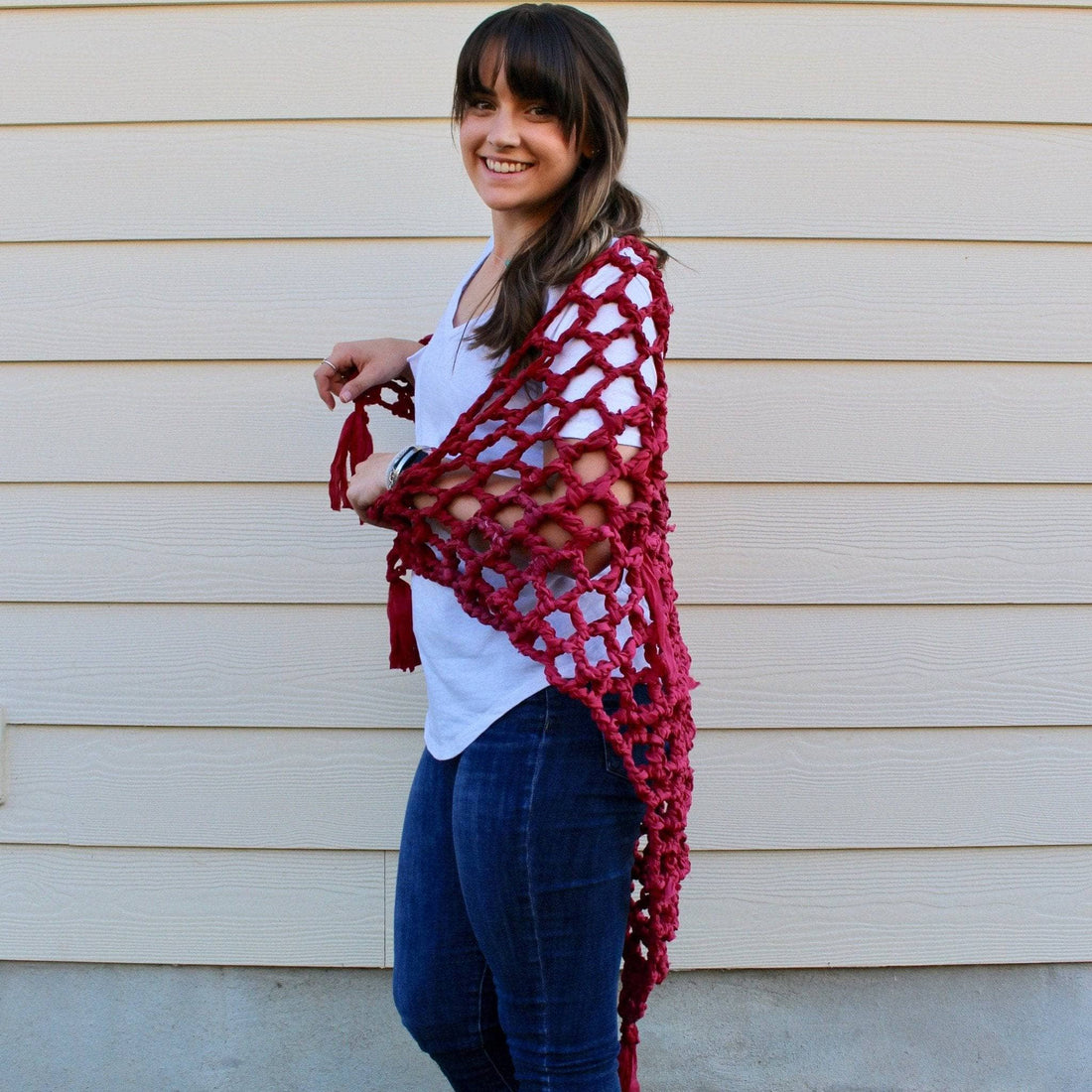 Colorful chiffon ombre yarn shawl draped over a mannequin