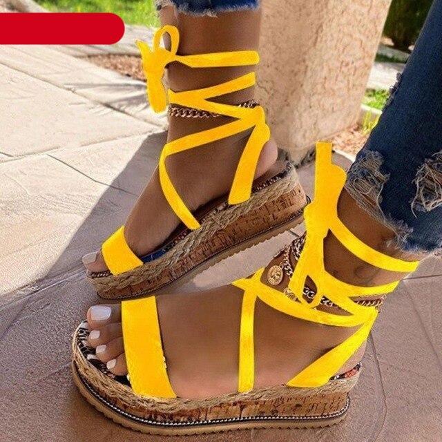 Women wearing yellow platform espadrille sandals with ankle strap and open toe design