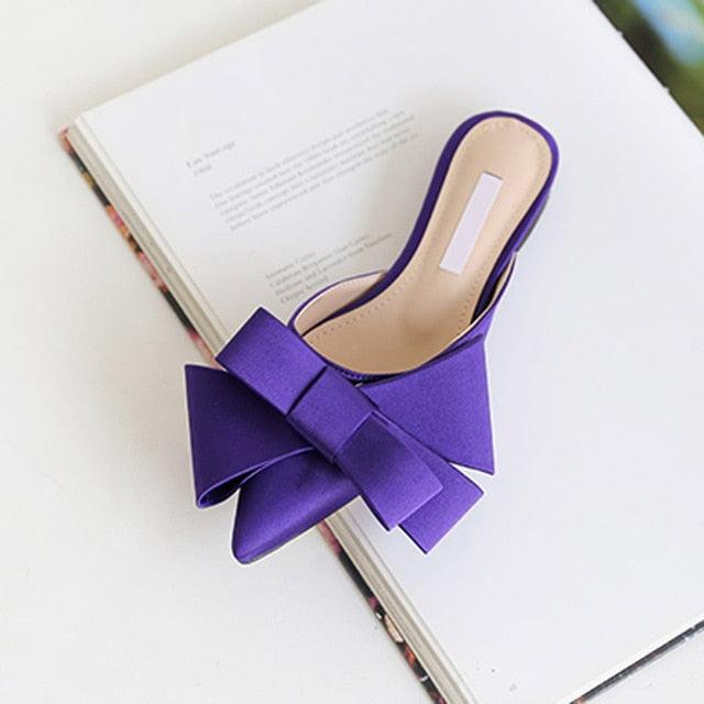 Elegant satin pointed-toe slides for women with a decorative bow