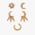 A set of celestial-themed earrings including sun and moon studs with opal and crystal accents on a white background.