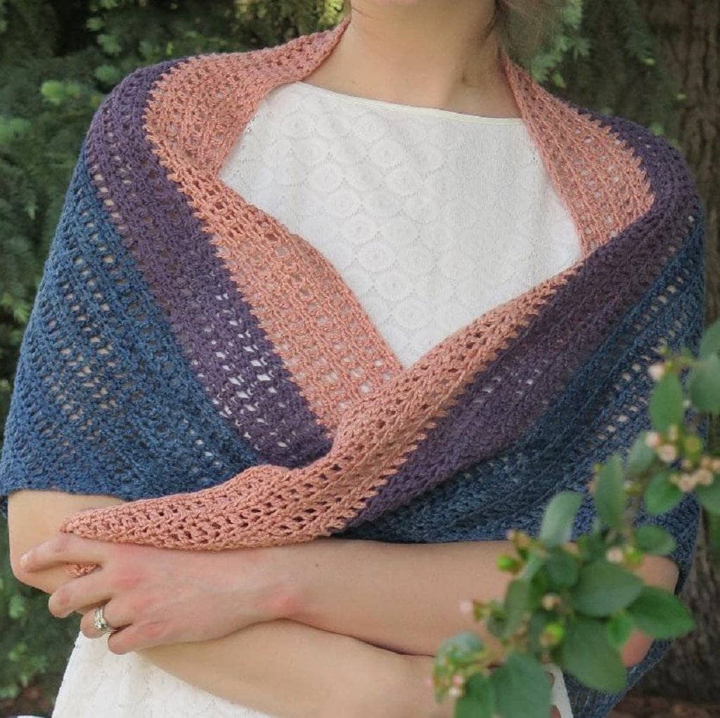 Sunset On The Water ombre shawl displayed on a model