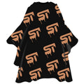 Professional Drip King barber cape in black and tan with hook-style adjustable closure