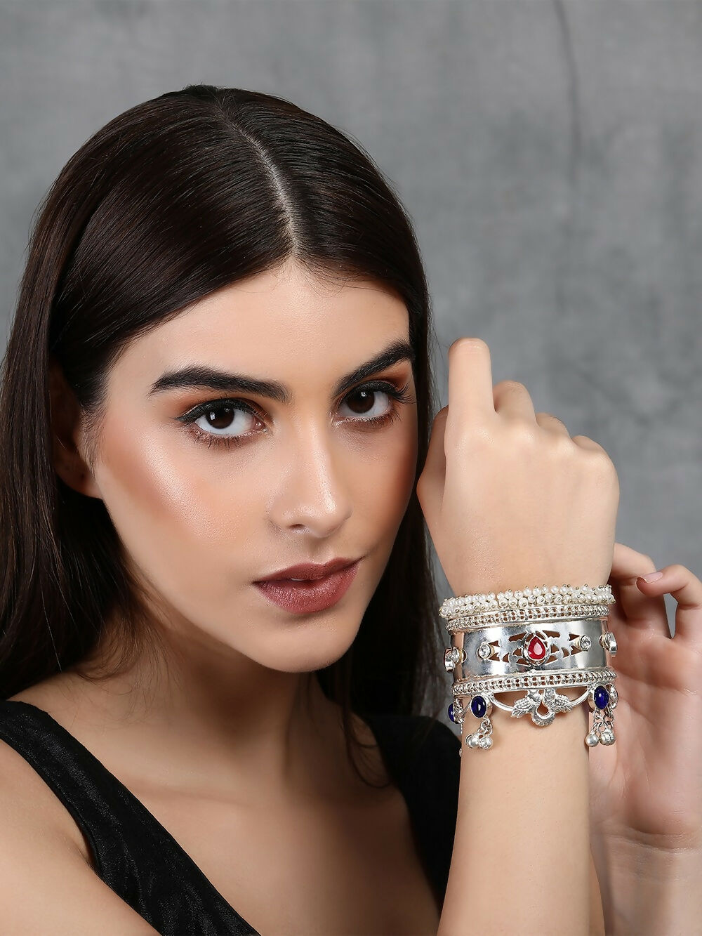 Handcrafted silver tone bangle with multicolor stones for women, styled for ethnic and indo-western wear.