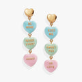 Sweethearts® statement drop earrings featuring heart-shaped charms with text inscriptions in pink, green, and blue.