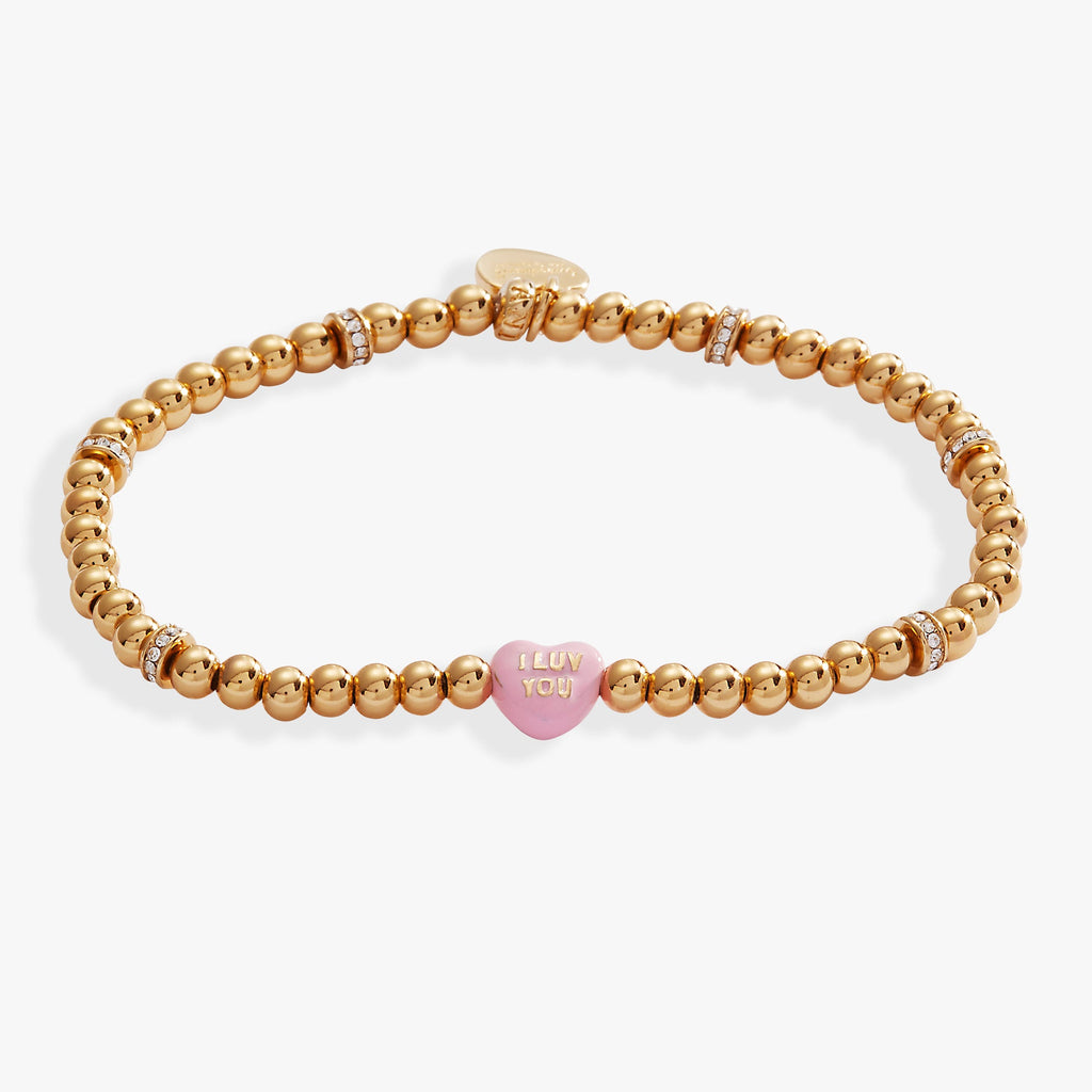 Sweethearts I Luv You beaded stretch bracelet with a pink and gold-tone candy heart charm.