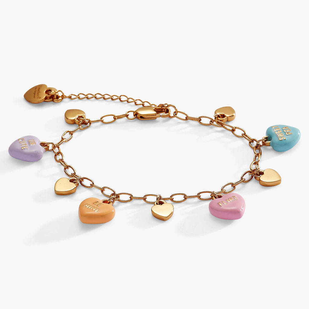 Gold-tone chain bracelet featuring Sweethearts candy-inspired heart charms.
