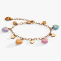 Gold-tone chain bracelet featuring Sweethearts candy-inspired heart charms.