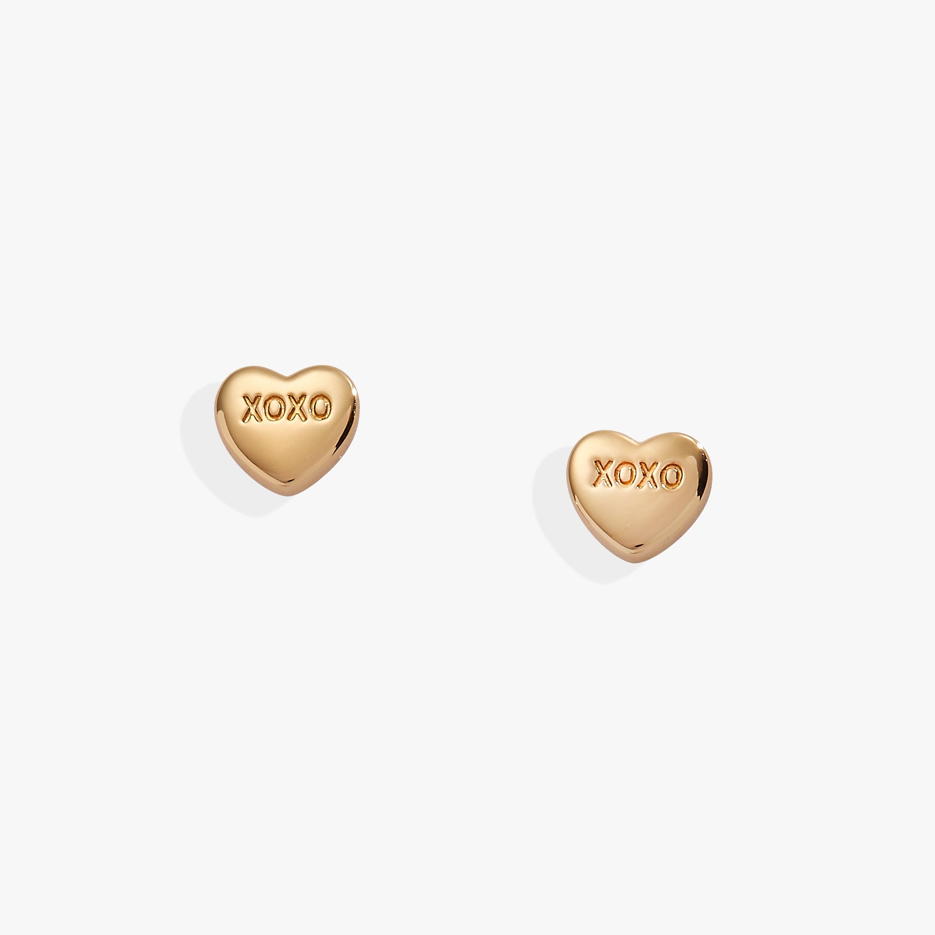 Alex and Ani gold-tone XOXO heart stud earrings inspired by Sweethearts candy.