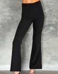 A pair of classic black trousers featuring a subtle side slit detail on the hem.