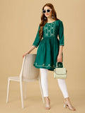 Women wearing a Rama colored viscose rayon embroidered casual top with sequence detail