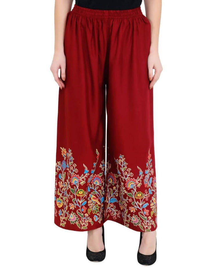 Maroon colored palazzo pants with an all-over floral print