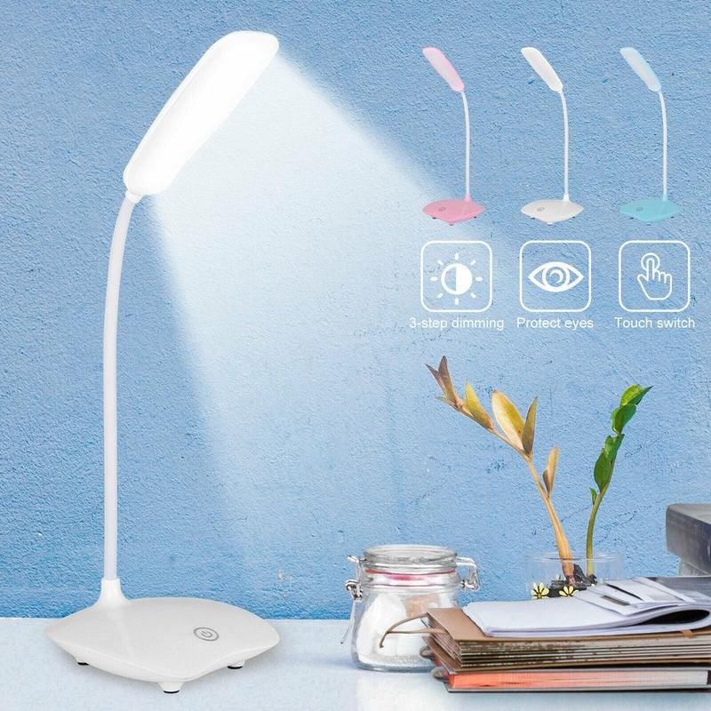 A modern minimalist rechargeable table lamp in white, pink, and blue, perfect for study desks.