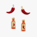 A pair of gold-plated stud earrings featuring an enamel red hot pepper and an orange hot sauce bottle design.