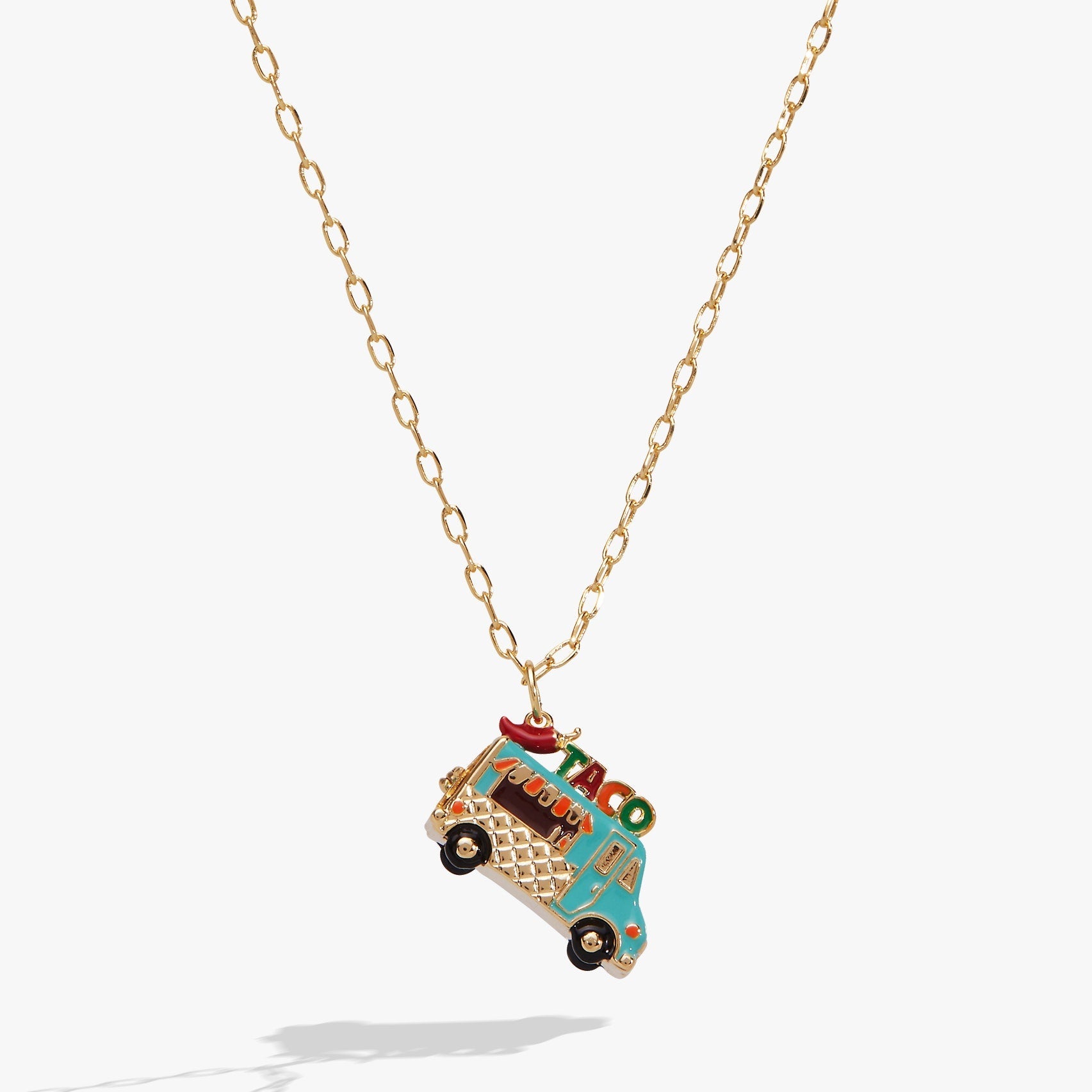 Gold-plated taco truck locket necklace with an open back revealing a tiny hot sauce charm