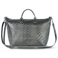 Modern metallic suede top-handle bag with geometric grid pattern and adjustable strap