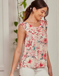 Model wearing a lightweight floral print rayon tank top with a casual relaxed fit