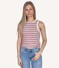 Close up of a woman wearing a fitted round neck ribbed striped tank in muted lavender and beige