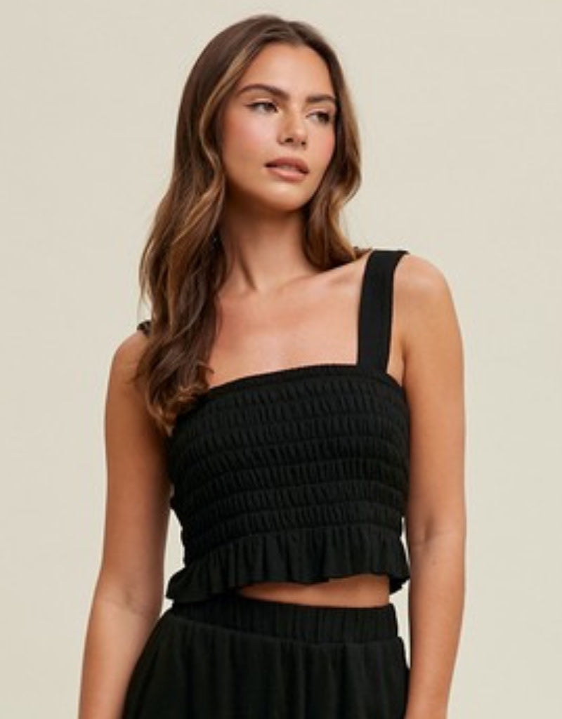 Close up of a black crinkle knit sleeveless tank top for women