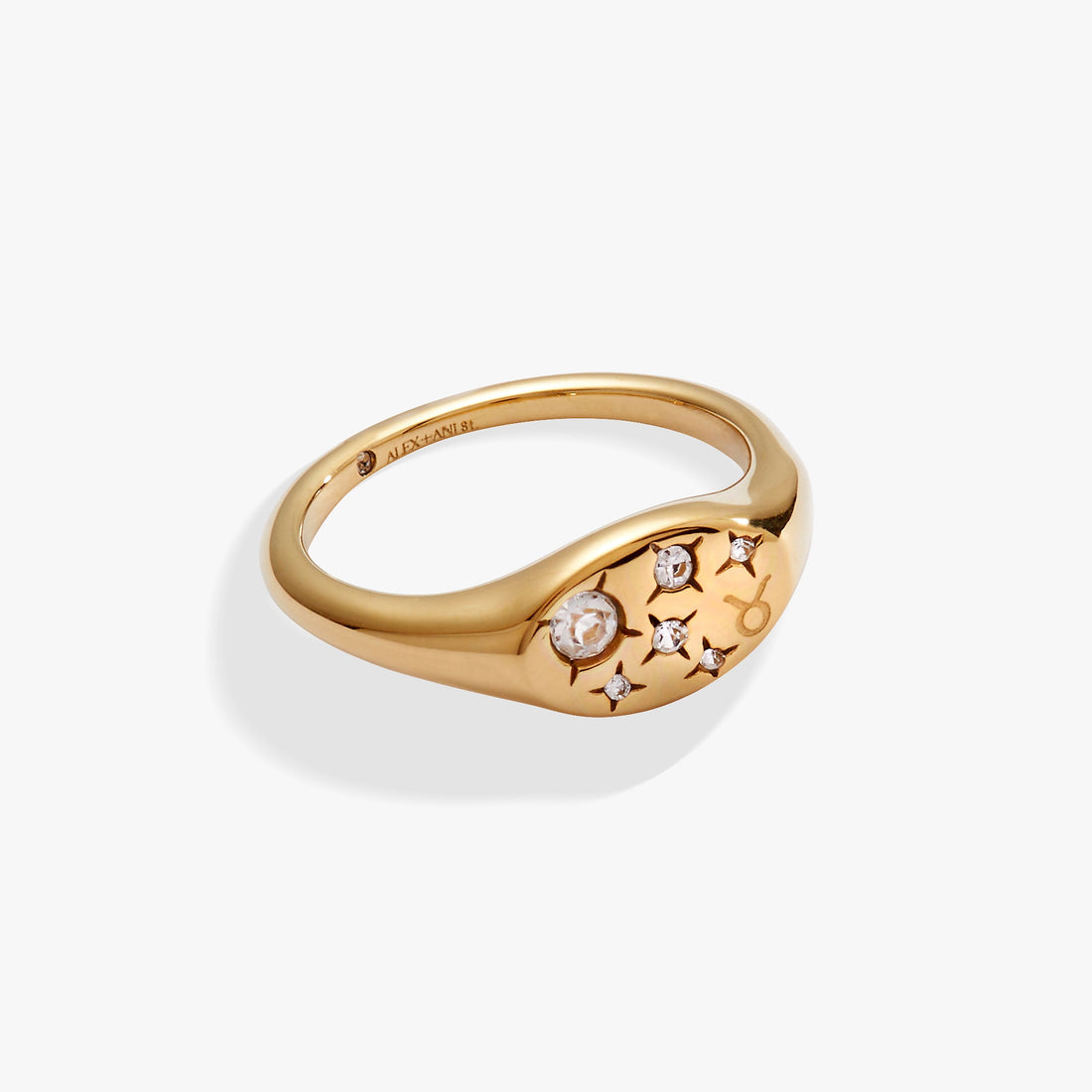 Gold Taurus zodiac signet ring featuring an etched bull symbol and clear crystal star accents