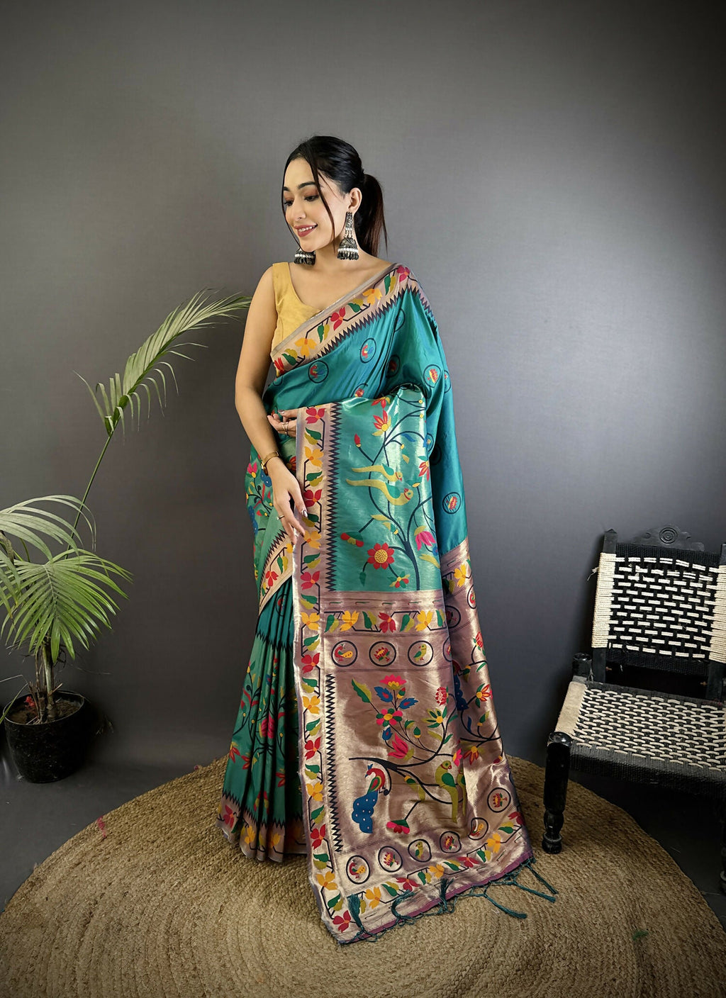 Cyan Blue Paithani soft silk saree with detailed Meenakari woven design.