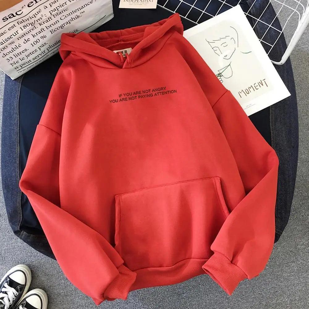 Girls black oversized hoodie with white letter slogan print, styled as casual streetwear