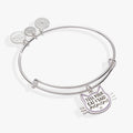Silver-tone expandable wire bangle with a cat face silhouette charm featuring purple and black details.