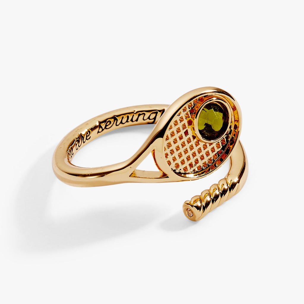 Close up of tennis racket wrap ring with 'you are serving' engraving detail