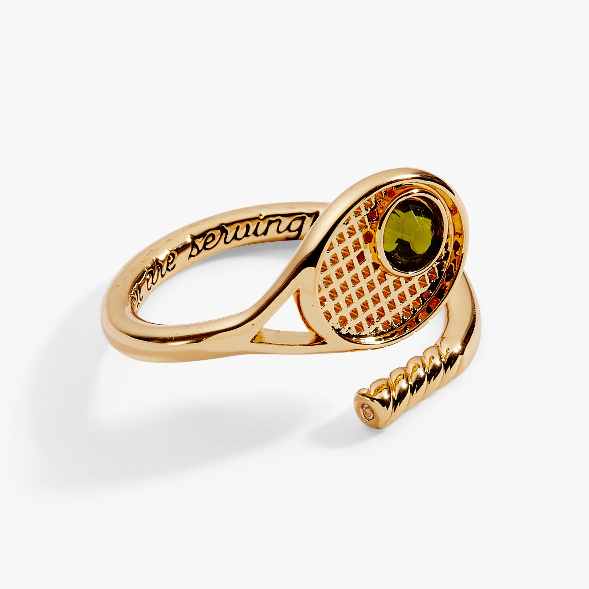 Close up of tennis racket wrap ring with 'you are serving' engraving detail