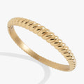 Gold tone stainless steel bangle with rope texture detail and hinge closure