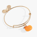 Gold tone bangle with orange pumpkin enamel charm and fall leaf detail