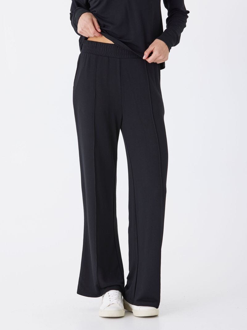 A pair of solid black, high-rise, wide-leg lounge pants in a soft knit fabric.