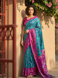 Bright sky blue Pochampally silk saree featuring traditional geometric weaving.