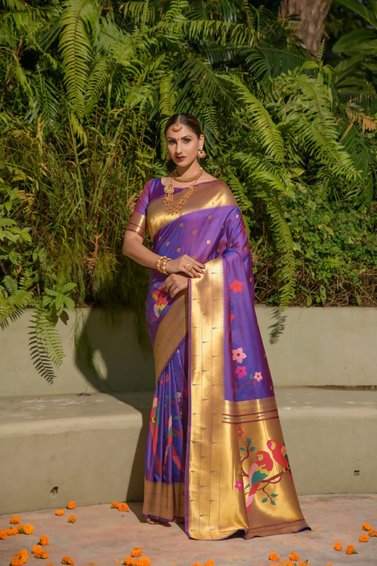 Elegant purple Paithani silk saree with intricate gold zari woven borders and matching blouse
