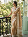 Vibrant Mustard Yellow linen saree displayed with matching blouse fabric.