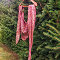 The Carnival Shawl knitted with speckled Malabrigo Mechita yarn featuring an asymmetrical design