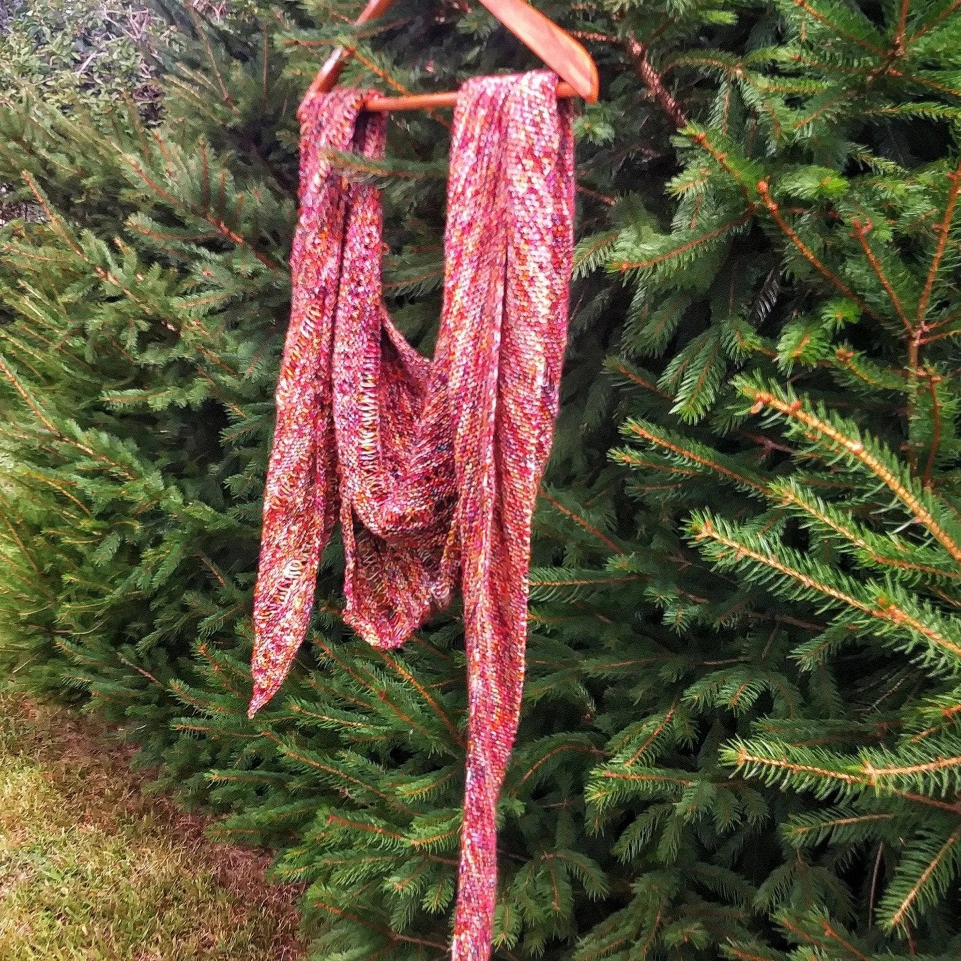 The Carnival Shawl knitted with speckled Malabrigo Mechita yarn featuring an asymmetrical design