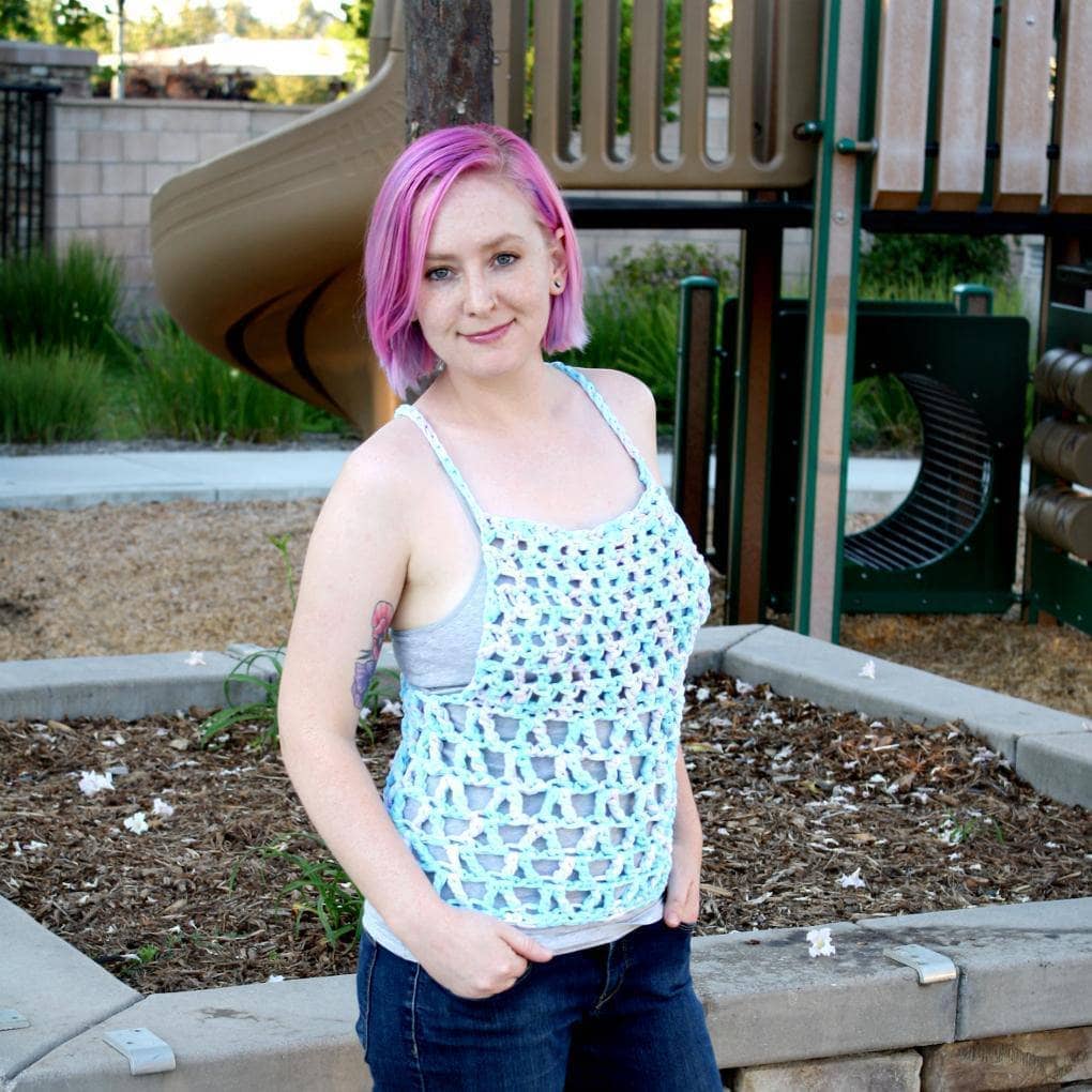 Woman wearing a handmade bohemian crochet Celia Tank Top in light blue