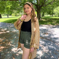 The Charlotte short sari robe worn as luxury loungewear with an artisanal, one-of-a-kind design.