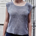 Close up view of the Crossed Stitched Top crochet pattern showing the texture of the sport weight linen yarn.