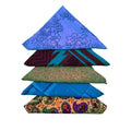 A colorful stack of five unique sari silk bandanas in various patterns and vibrant hues.