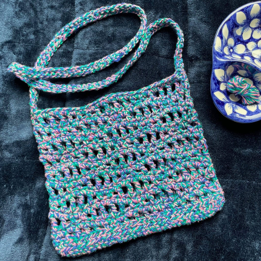 The Open Ocean Bag crochet pattern featuring open stitches and wave-crest detailing at the top
