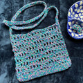 The Open Ocean Bag crochet pattern featuring open stitches and wave-crest detailing at the top