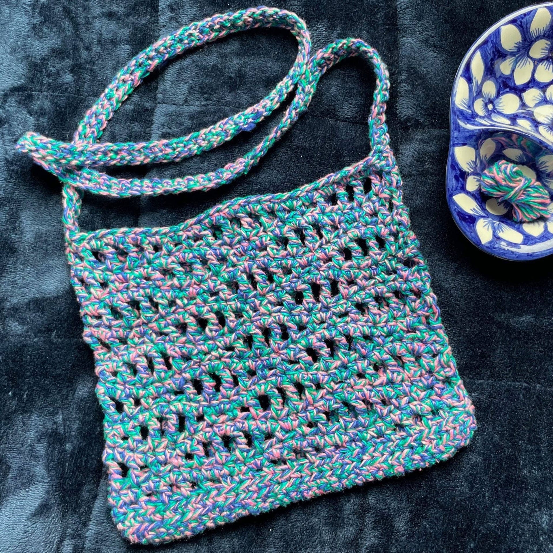 The Open Ocean Bag crochet pattern featuring open stitches and wave-crest detailing at the top