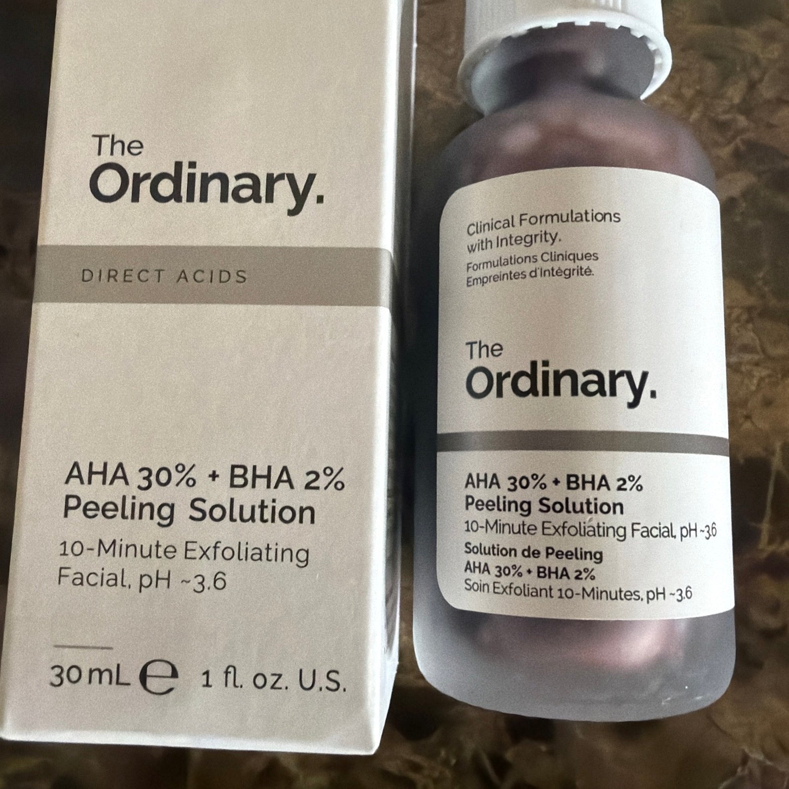 Bottle of The Ordinary AHA 30% + BHA 2% Peeling Solution with minimalist white and brown labeling.