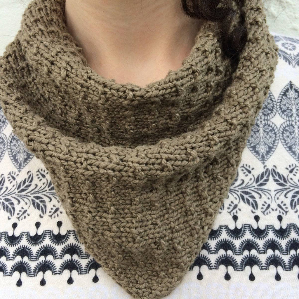 A luxurious handcrafted scarf made from Poppyseed herbal dyed silk yarn.