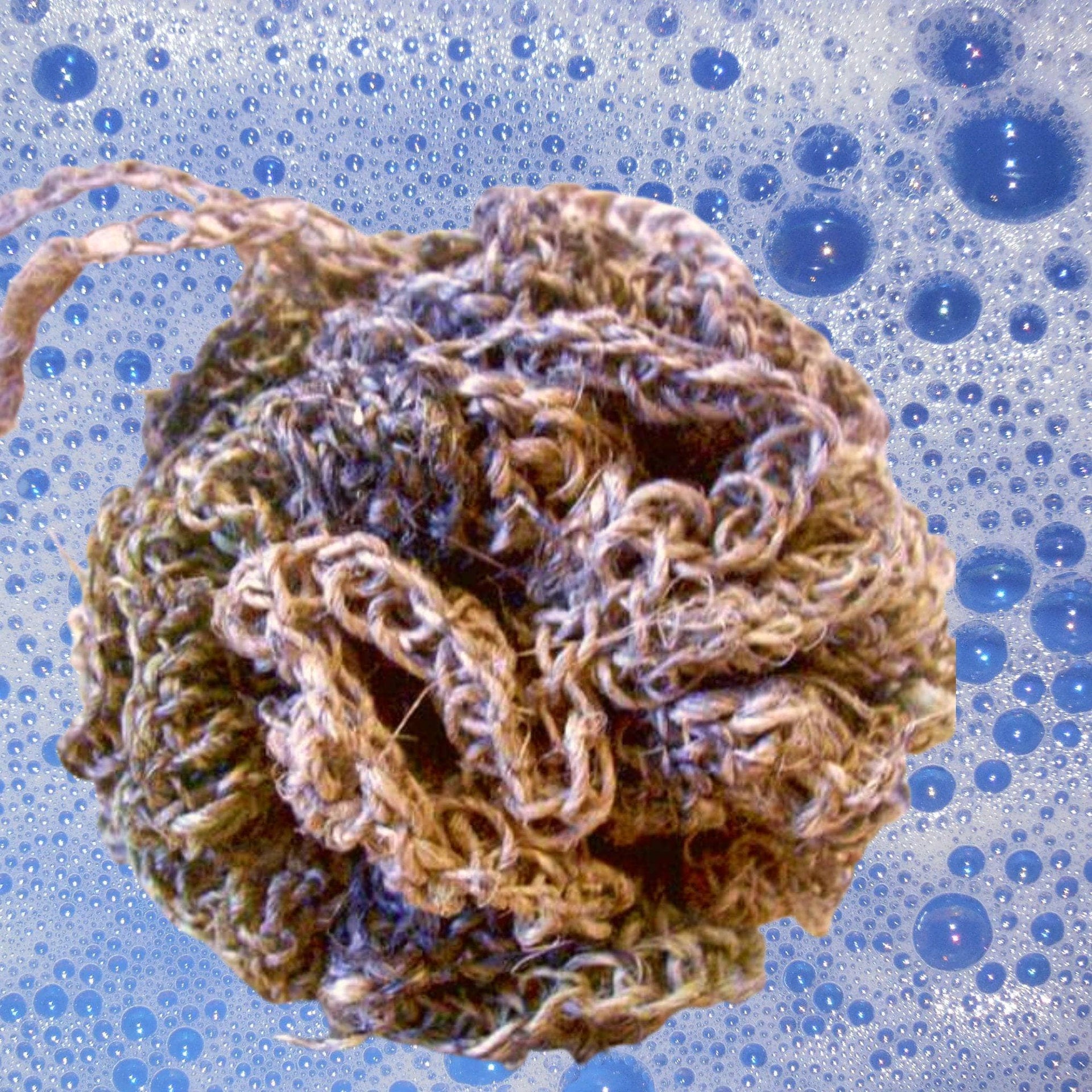 The Purist Hemp Shower Puff Kit featuring brown and teal hemp yarn with included crochet tools.
