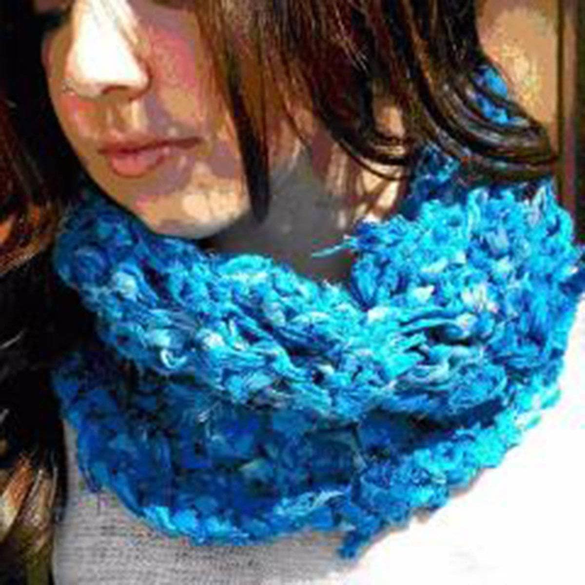 Close up of the Sara Cowl knitted with colorful Sari Silk Ribbon