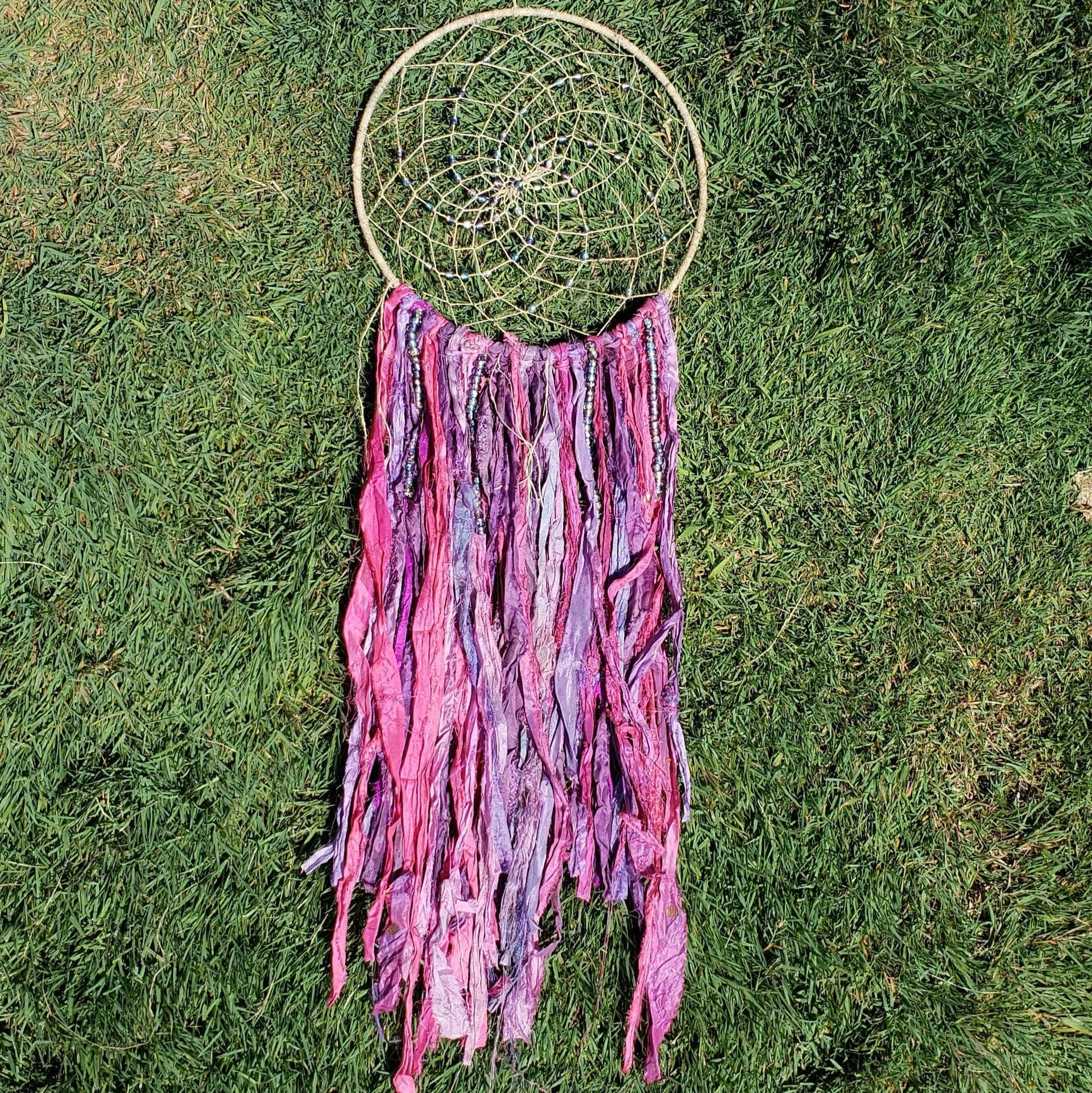 DIY bohemian dreamcatcher kit with fuchsia, violet, and natural jute ribbons on a 10-12 inch hoop.