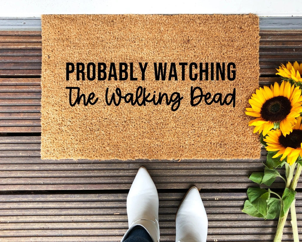 Natural brown coir doormat with Walking Dead theme lettering for a front porch.